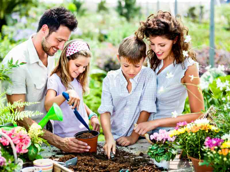 family planting a garden