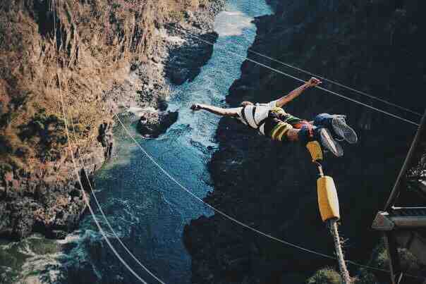 bungee jumping over a canyon