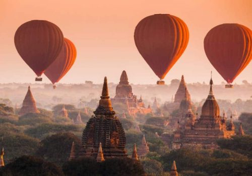 Hot air balloon over plain of Bagan in misty morning, Myanmar